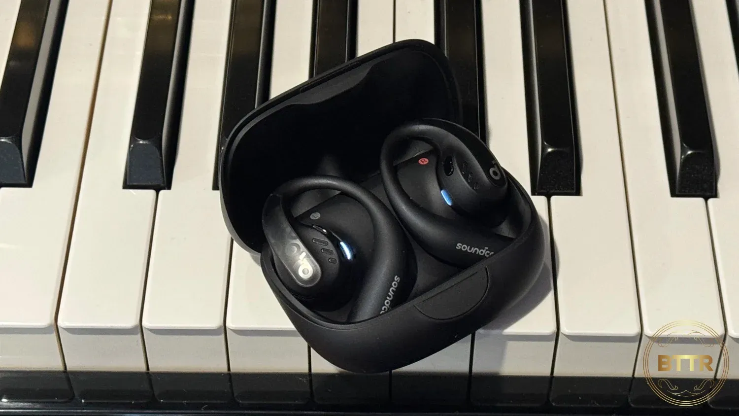 Anker Soundcore Aerofit Pro on a piano