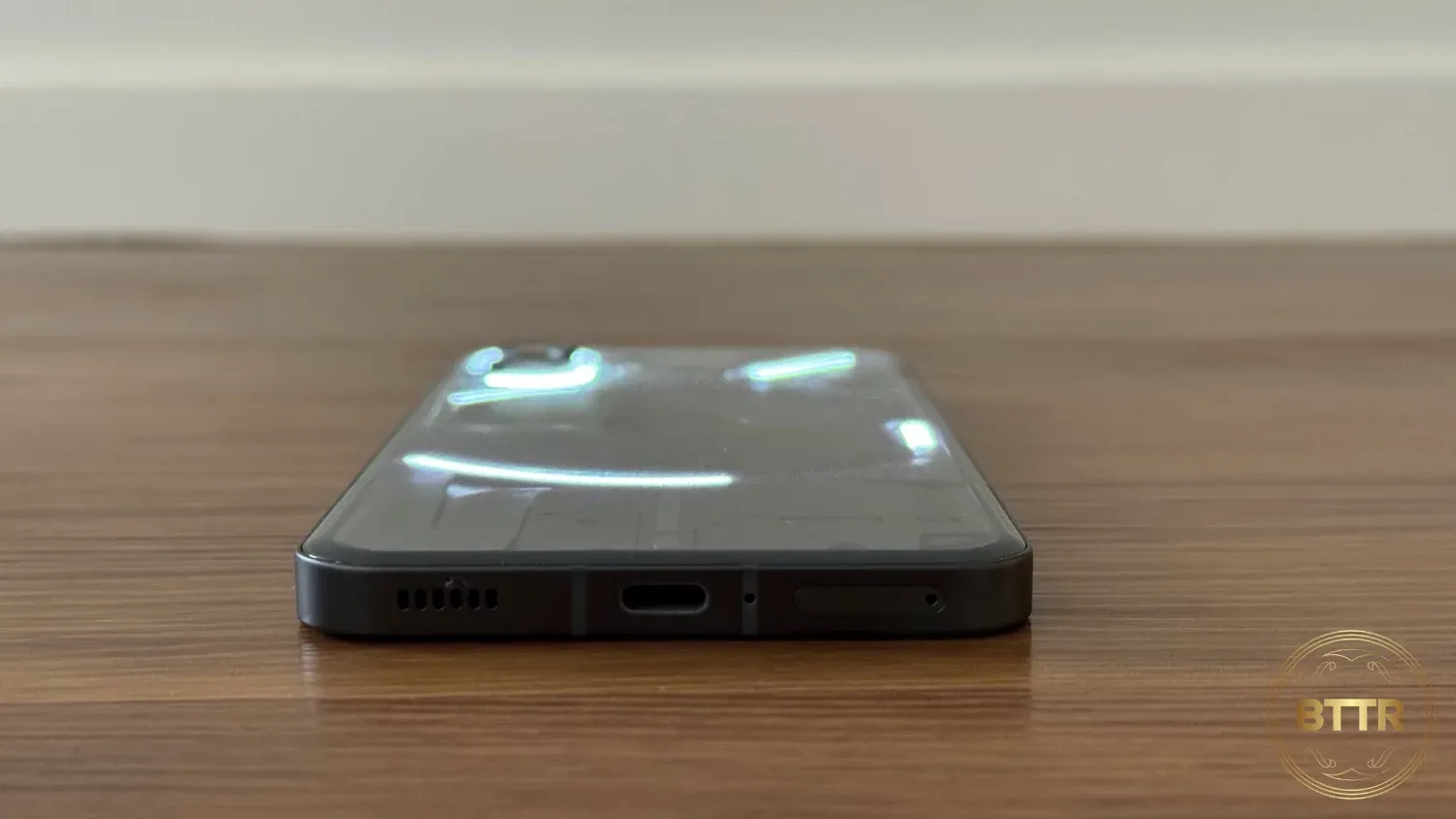 Looking at the charging port of the Nothing Phone (2)