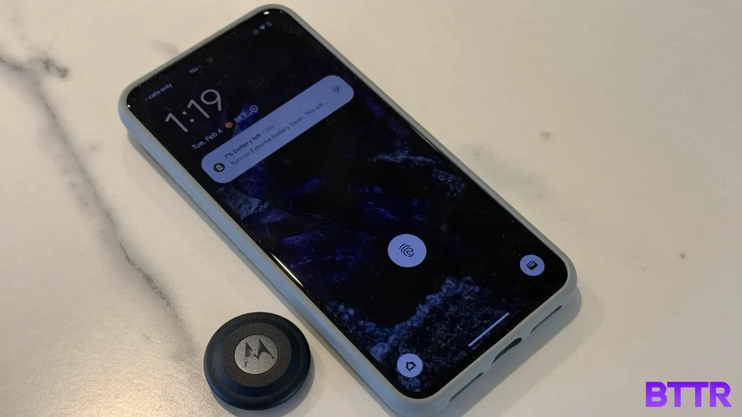 The Moto Tag next to a Pixel 8