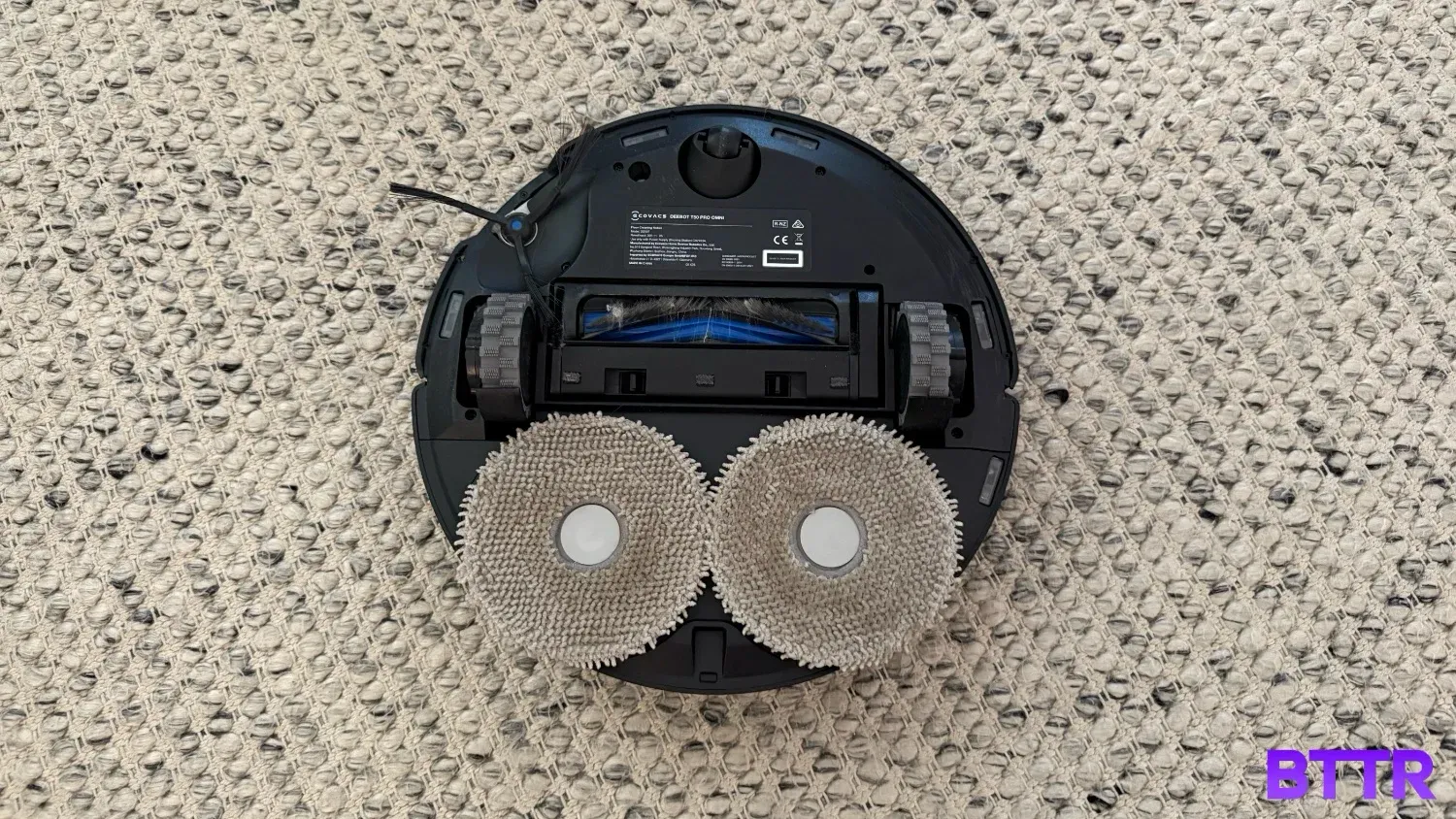 The underside of the unit. It still has some hair tangled in the main brush, and the mop pads still need a proper clean occasionally.