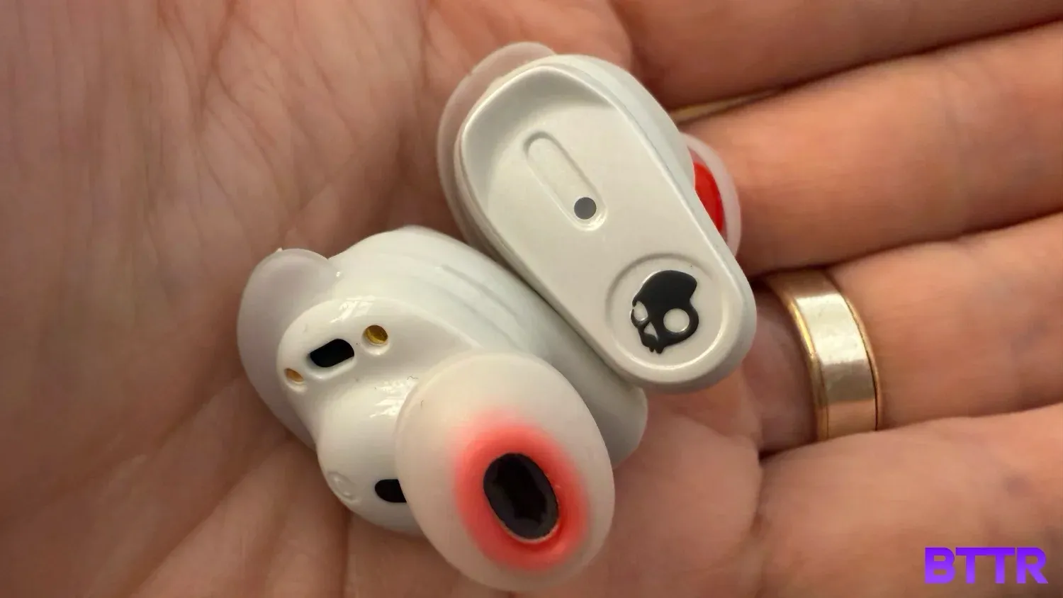 Holding the Method 360 ANC earbuds in my hand