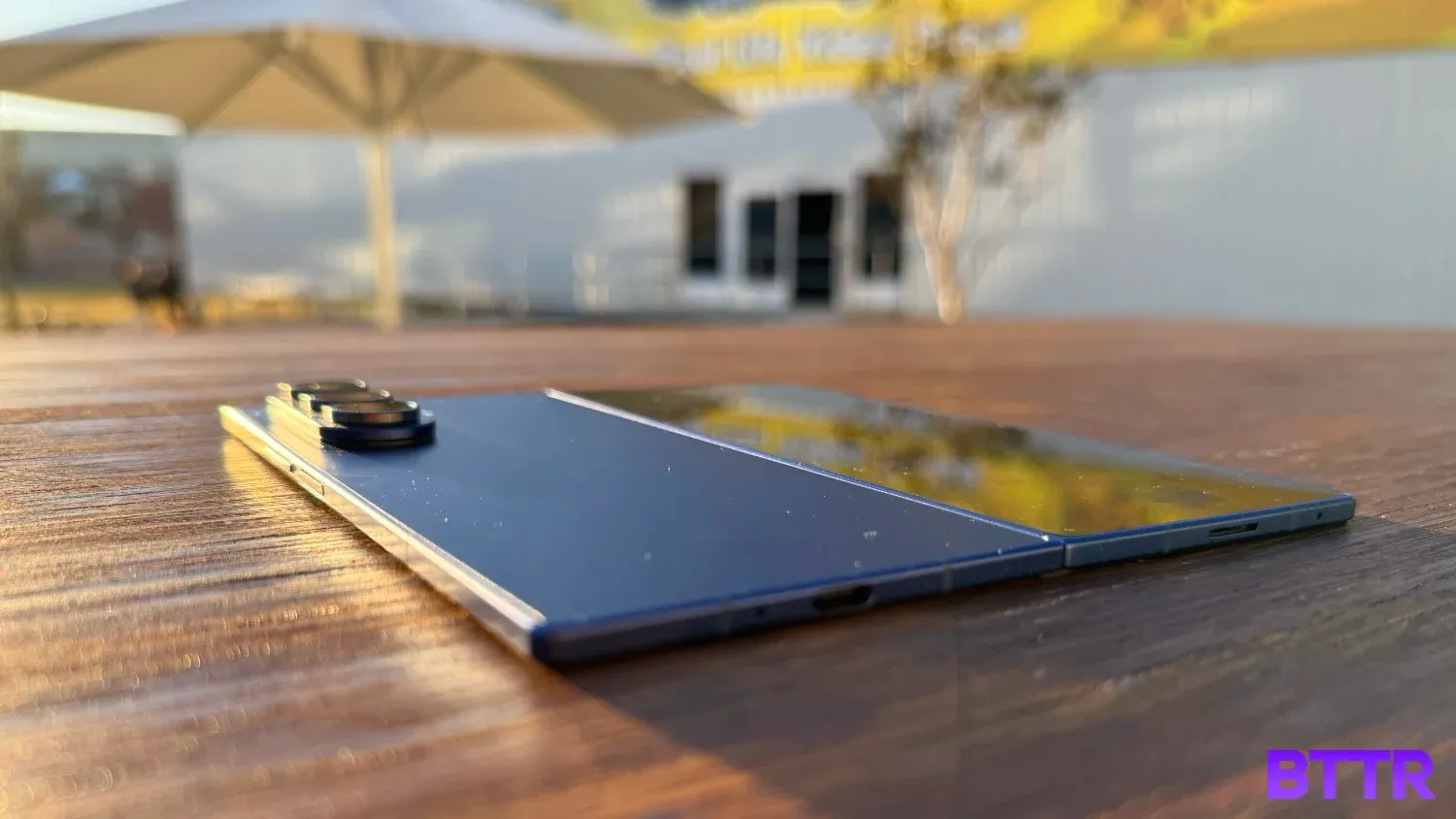 The Fold7 laying flat on a table in the sun