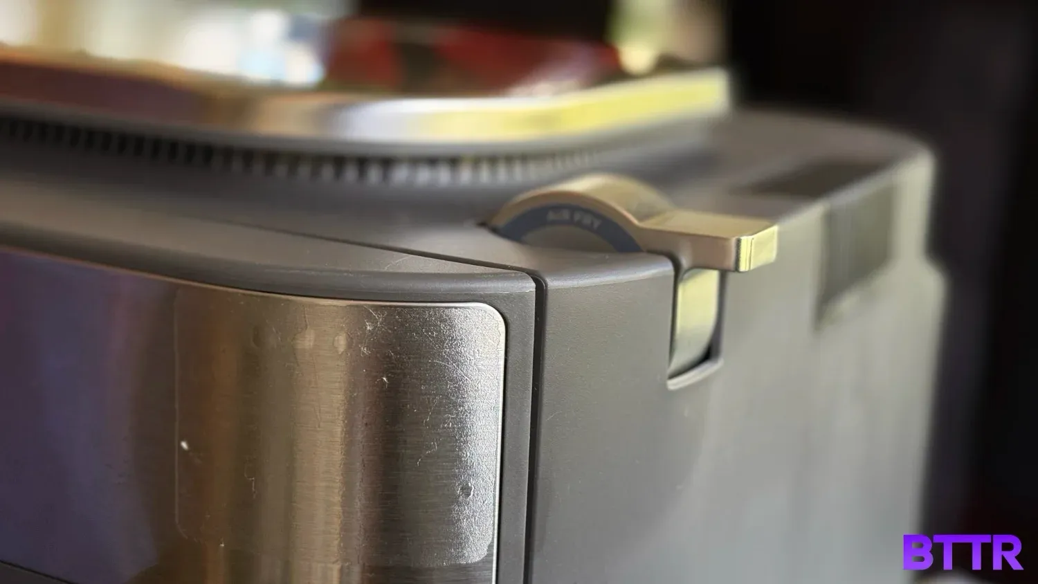 The top lever that switches between combi meals and air fry cooking mode