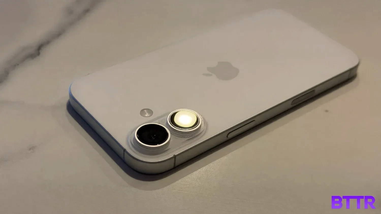 The iphone 17 on a bench, face down