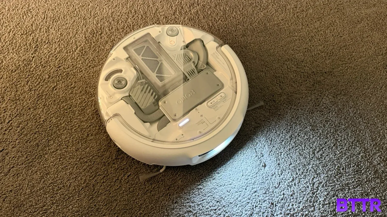 The ROMO P vacuuming carpets