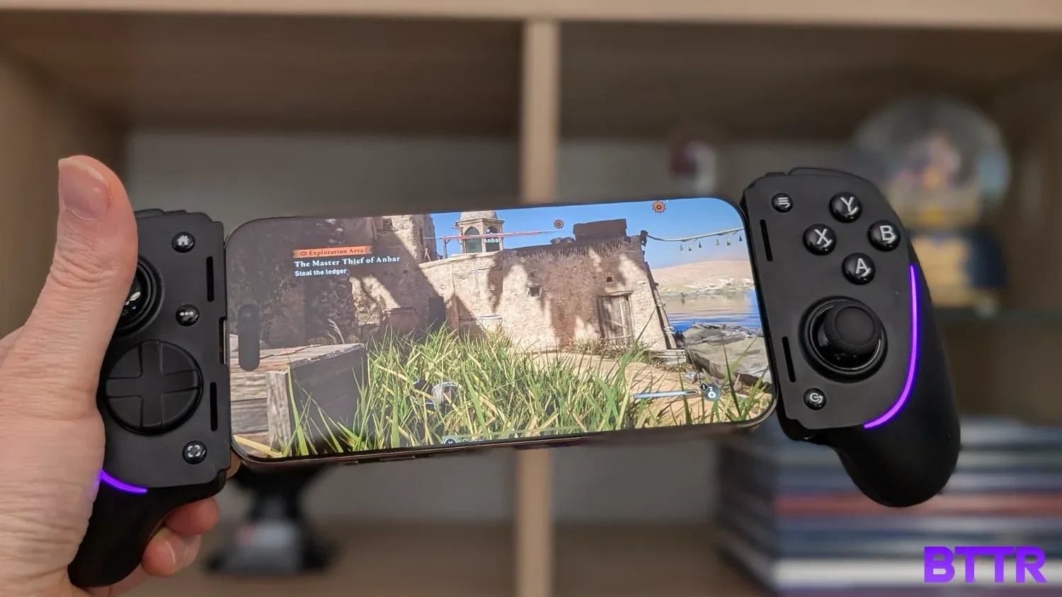 Hiding in grass playing Assassin's Creed on an iPhone with the Razer Kishi Ultra