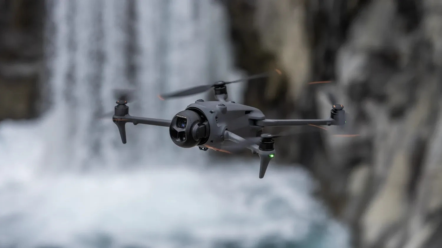 The Mavic 4 Pro flying in front of a waterfall