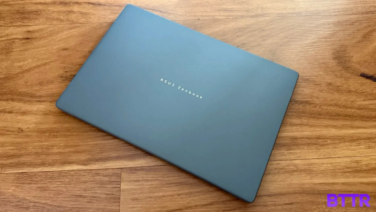 The Zenbook A14 on floorboards