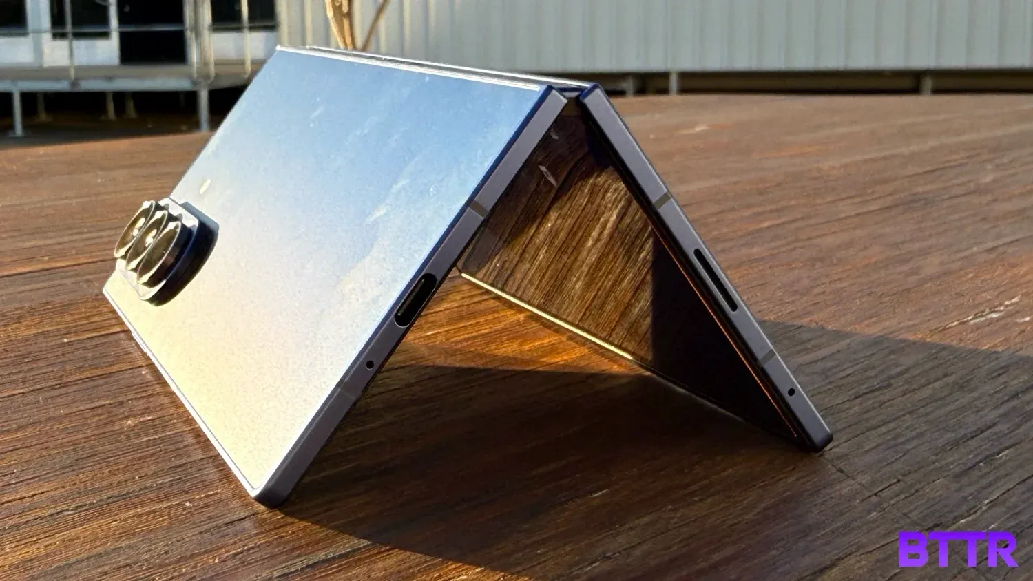 The Galaxy Z Fold7 folded on a table in the sun