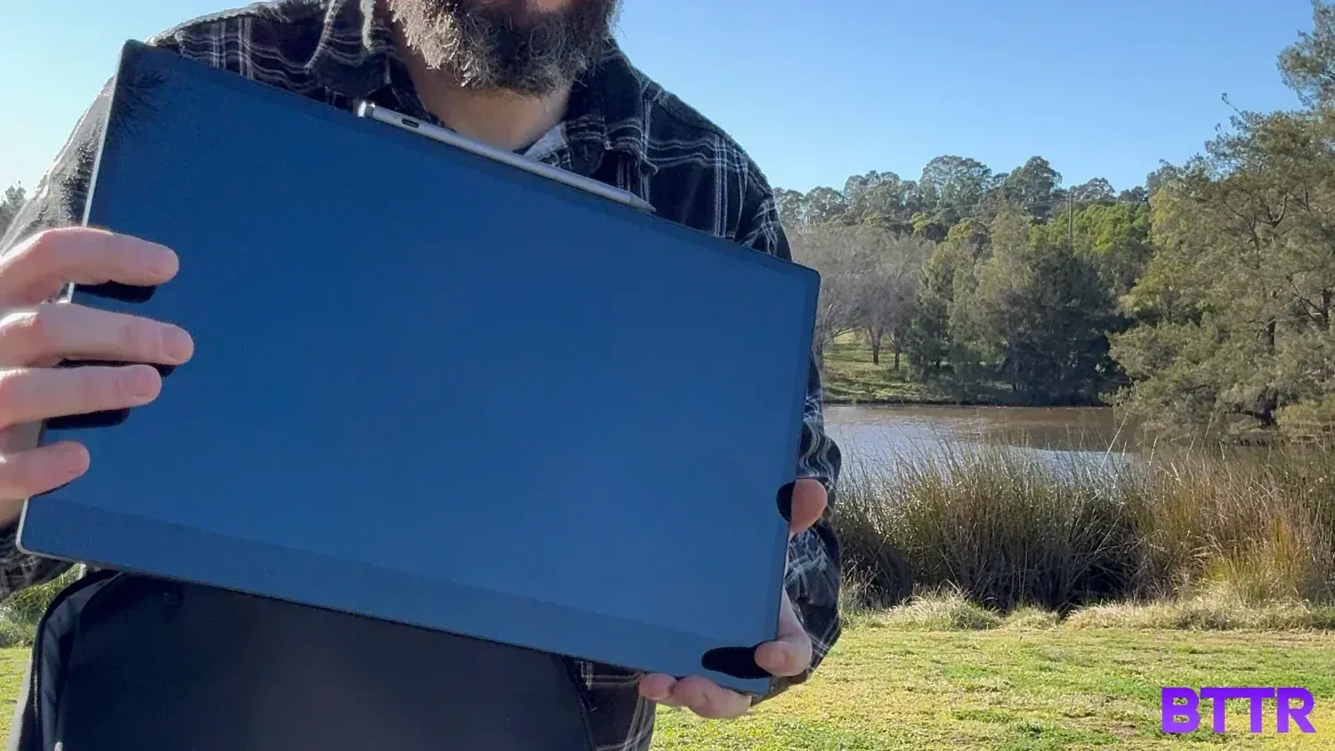 Holding the 15 Pro in the botanic gardens as I get ready to work from anywhere