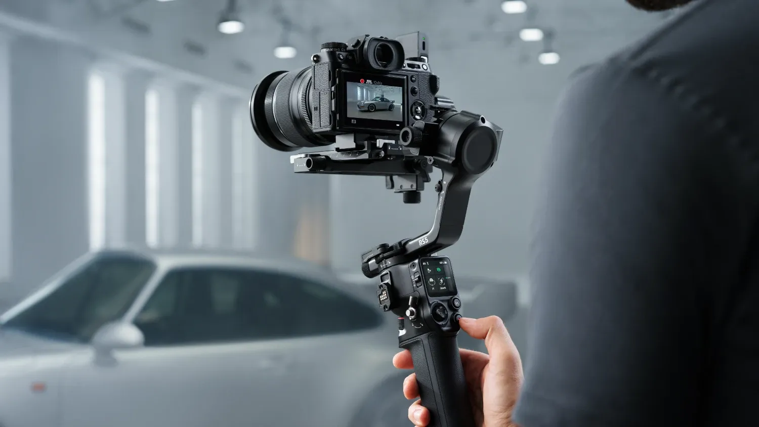 The DJI RS 5 with a camera filming a car