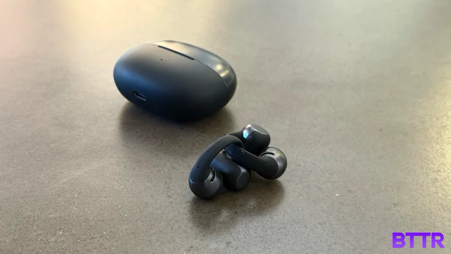 The Shokz OpenDots ONE on a table