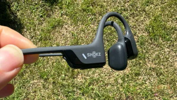 Holding the Shokz OpenRun Pro 2 in my hand