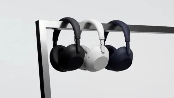 the three colours of the Sony WH-1000XM6 hanging on a metal bar